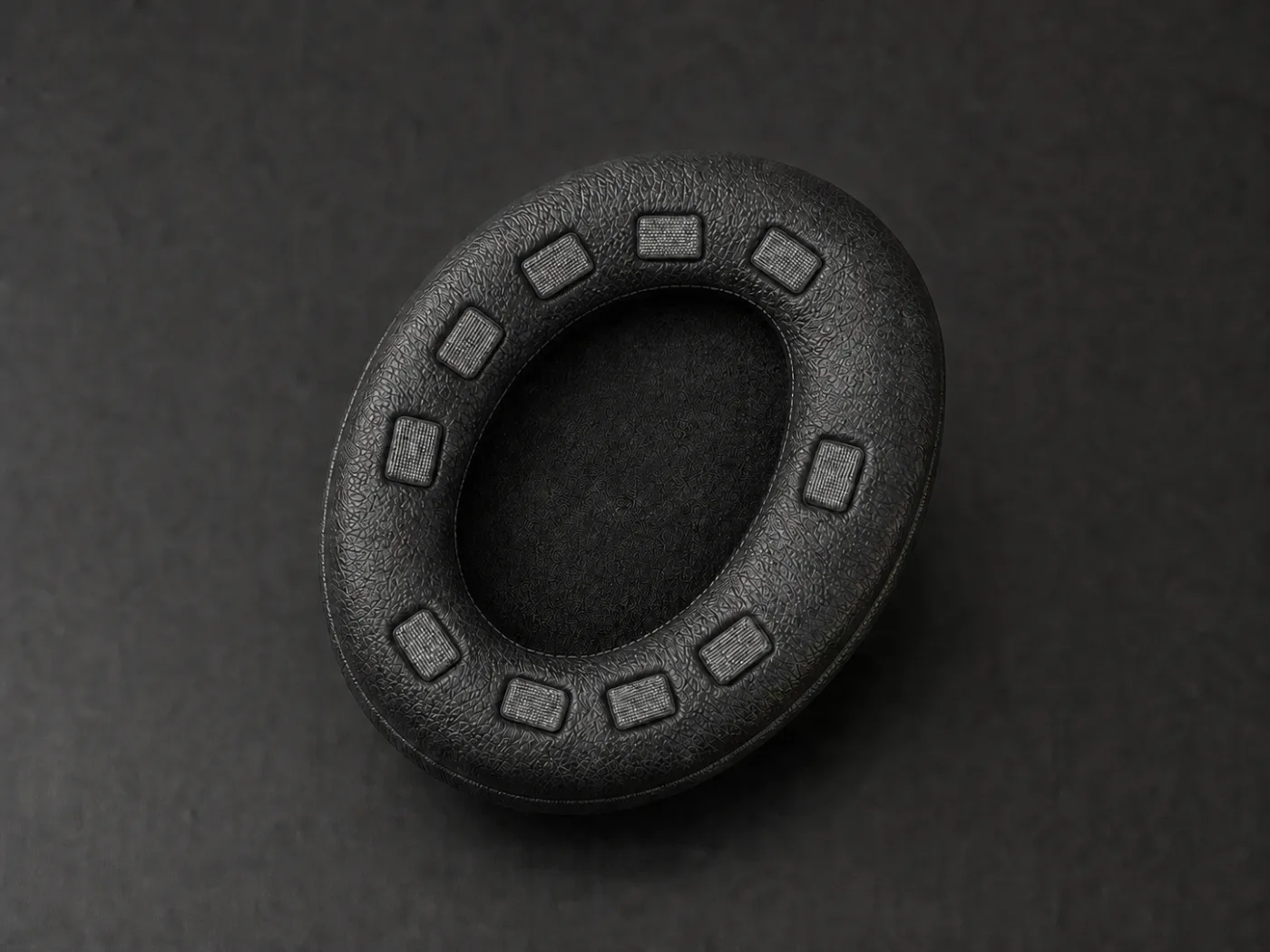 NeuroFocus prototype ear pad with electrode pads in the cushion
