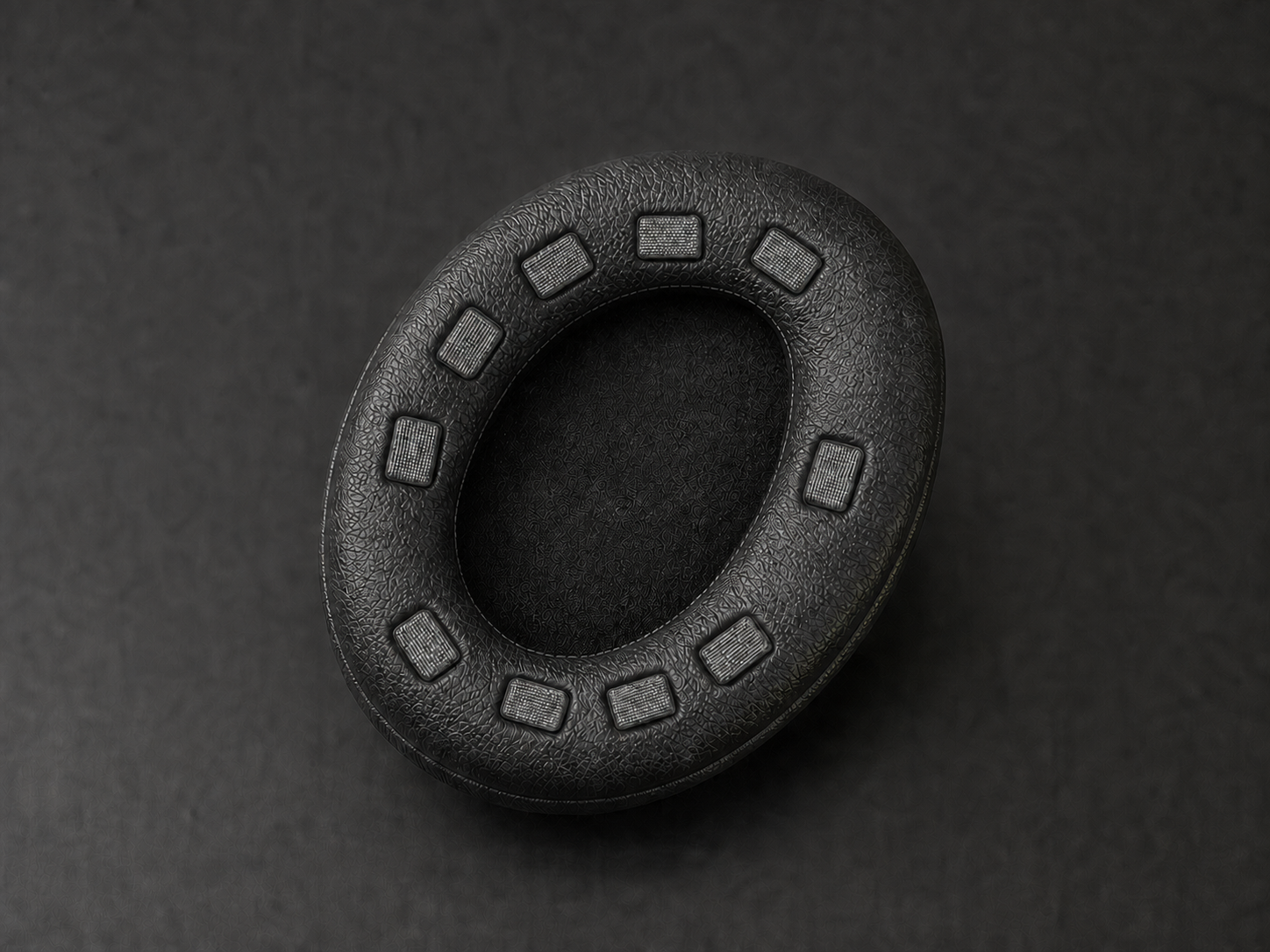 Neurofocus EEG ear pad with ten conductive-fiber electrodes
